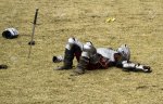 6354009-defeated-knight-lays-immobilized-after-the-tournament.jpg