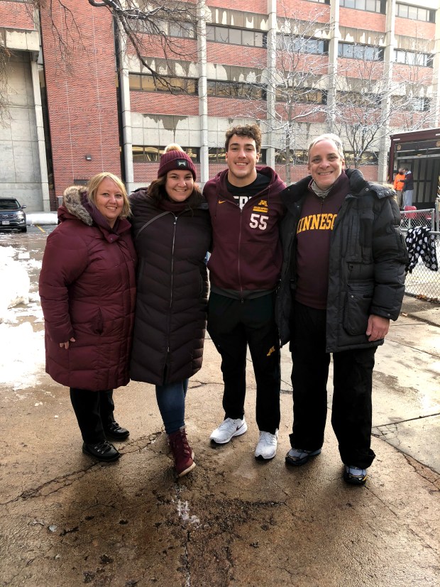 Minnesota linebacker Mariano Sori-Marin, second from right, with his family after a football game at Nebraska in 2020