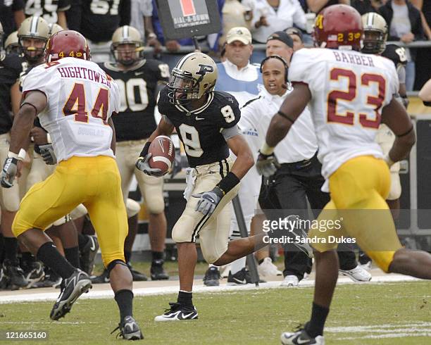 purdue-wr-dorien-bryant-runs-on-an-end-around-as-deon-hightower-and-picture-id121665160