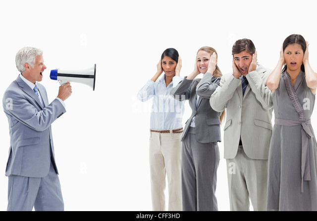 man-yelling-in-a-megaphone-at-business-people-with-their-hands-over-cff3hd.jpg