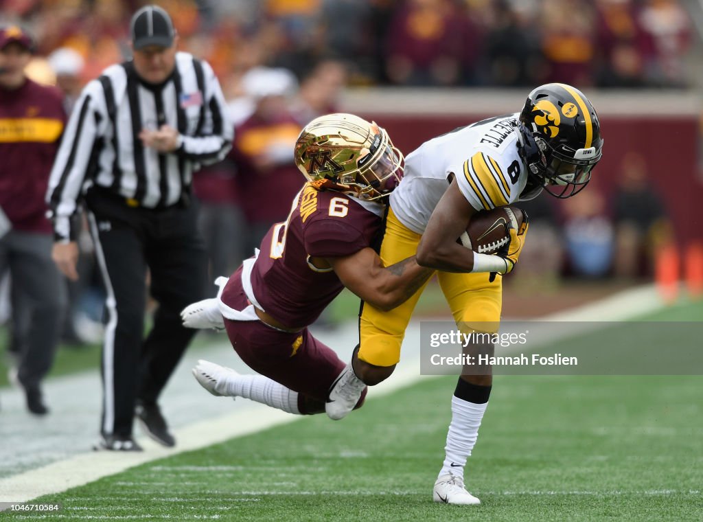 chris-williamson-of-the-minnesota-golden-gophers-pulls-ihmir-of-the-picture-id1046710584