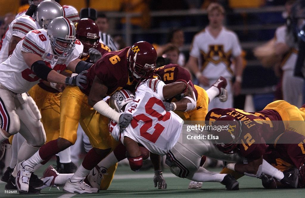 nov-2001-maurice-hall-of-ohio-state-gets-tackled-by-jimmy-henry-and-picture-id512649