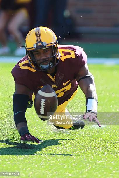 october-11-2014-gophers-wide-receiver-logan-hutton-attempts-to-down-a-picture-id579015770